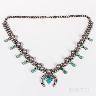 Navajo Silver and Turquoise Squash Blossom Necklace, c. 1940s, with silver handmade beads, ten small blossoms each with two stones, and