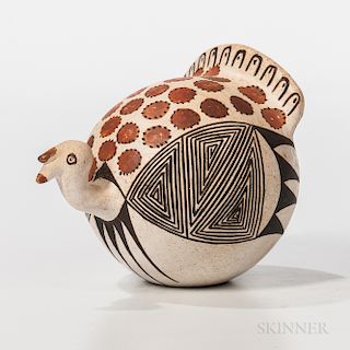 Acoma Polychrome Pottery Turkey, signed "Lucy M. Lewis," decorated with abstract feather designs in browns, ht. 3 1/4 in.