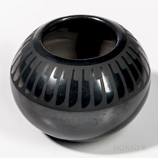 San Ildefonso Black-on-black Pottery Jar, signed "Maria, Popovi 769," with classic feather design below the rim, ht. 3 1/2, dia. 4 in.