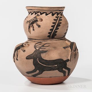 Two-lobed Black-on-gray Effigy Vessel, Cochiti, c. 1967, with deer and raised Gila monster design and spirit line, ht. 7 1/2 in.Exhibit