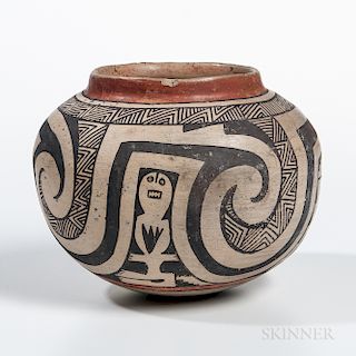 Casas Grande Storage Jar, c. 1200-1450, painted overall in a red and black geometric design on a cream slip, ht. 6 1/2 in.Provenance: P
