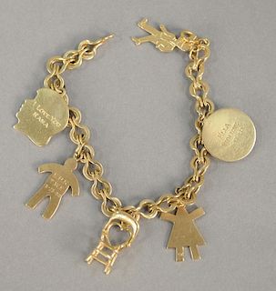14 karat gold charm bracelet with 14 karat gold charms. 30.8 grams