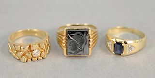 Three gold mens rings, (2) 14 karat and (1) 10 karat.
