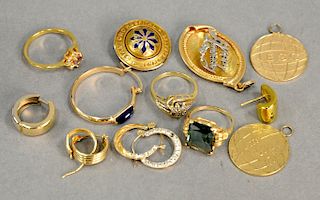Group of 14 karat gold rings, pins, earrings, and two 10 karat round charms. 34 total grams