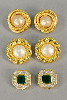Three pairs of earrings including two pairs of Chanel earrings in original boxes, marked: Chanel; along with a pair of clip-on earri...