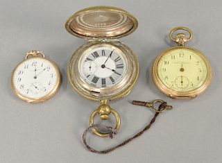Three pocket watches including a large key wind with silver interior and case exterior plated, and one gold plated.