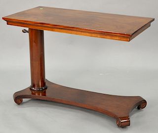 Empire serving table with turning top overturned shaft, height 28.75 inches, length 40 inches.