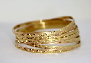 Seven Laser Diamond Cut 18K Gold Bangle Bracelets