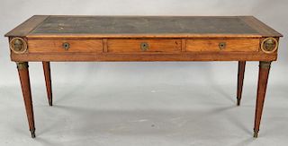 Continental writing table with tooled leather top (restored). ht. 29 1/2 in., top: 25" x 67"