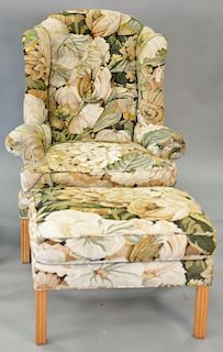 Kravet Furniture wing chair and ottoman with tapestry type upholstery.