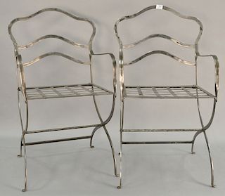 Pair of contemporary polish metal armchairs.