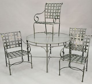 Five piece Brown Jordan outdoor set to include a glass top table and four chairs. dia. 48 in.