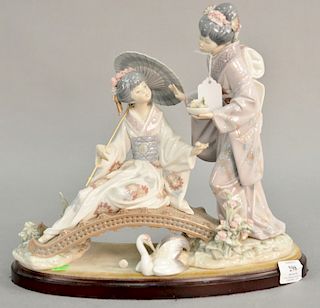 Lladro porcelain figurine having two Geisha girls on a bridge "Springtime in Japan" signed on bottom. ht. 13 in., lg. 14 in.