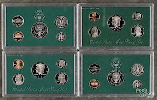 Four United States proof sets, to include a 1994, a 1995, a 1997, and a 1998.