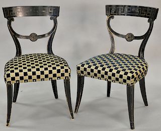 Pair of contemporary black and gilt side chairs in a checkered black and gold upholstery, seat height 17.5 inches.
