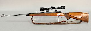 Winchester model 70 300 H + H magnum bolt action rifle with tasco 3-9x40 scope.