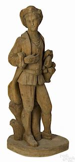 Carved pine figure of a young man with a basket of fruit, 46'' h.