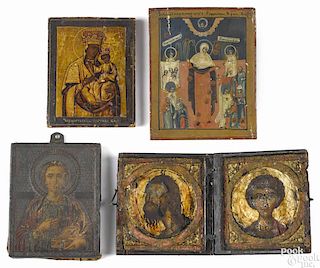 Two Russian oil on panel icons, 19th c., together with an icon with a painted tin oklad