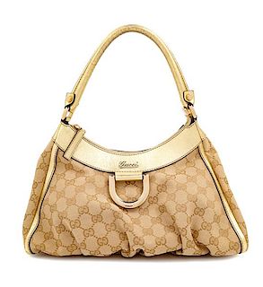 A Gucci Beige Monogram Gold D Ring Handbag, 8.5" H x 12" W x 4.5" D; Handle drop: 7".