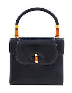 A Gucci Navy Leather Vintage Flap Handbag, 7.25" H x 8" W x 2.75" D; Handle drop: 4".