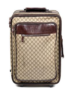 * A Gucci Monogram Canvas Roller Suitcase, 22" H x 15.25" W x 9.25" D; Handle: 1.25".