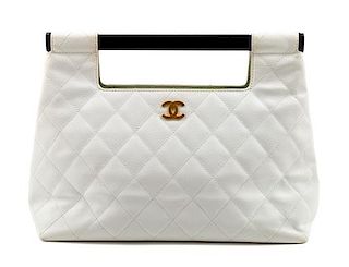 A Chanel White Caviar Quilted Melrose Cabas Wood Handle Bag, 10.5" H x 13.5" W x 4.5" D; Handle drop: 2".
