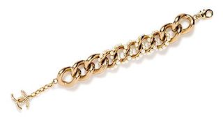 A Chanel Brushed Goldtone Link and Pearl Bracelet, 7.5" L x 1" W.