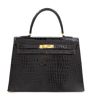 An Hermès Vintage Black Crocodile Kelly Bag, 9" L x 13" W x 4.5" D; Handle drop: 4.5".