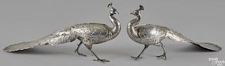 Pair of Continental silver peacocks, late 19th c., with articulated wings, 9'' h., 19 1/2'' l.