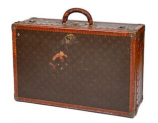 A Louis Vuitton Monogram Canvas Hardsided Suitcase, 15.5" H x 23.75" W x 8" D; Handle drop: 2.25".