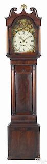 Regency mahogany tall case clock, ca. 1830, with an eight-day movement and a painted face