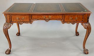 Maitland Smith Chippendale style writing table with leather top having three drawers. ht. 30 in., top: 31 1/2" x 57"