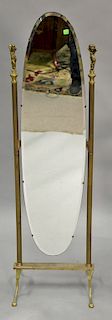 Oval brass cheval mirror with beveled glass attributed to Peerage England. ht. 54 in.