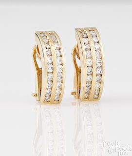 Pair of 14K yellow gold diamond earrings