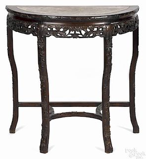 Chinese carved rosewood console table, early 20th c., with a marble inset top, 32'' h., 32'' w.