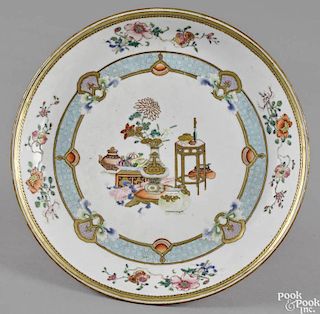 Chinese export porcelain shallow dish, 18th c., the center decorated with scholarly objects