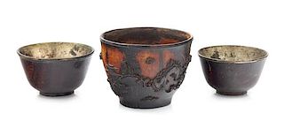 * Three Chinese Carved Coconut Shell Wine Cups Diameter of largest 3 inches.