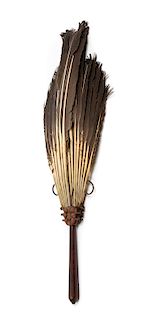 * A Chinese Carved Hongmu Feathered Fan Length 19 inches.