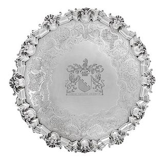 * A George II Silver Salver, David Willaume II, London, 1744, having a rocaille and S-scroll decorated rim, the center with and