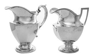 * Two American Silver Water Pitchers, various makers, 20th Century, each of tapering paneled form, comprising an example marked