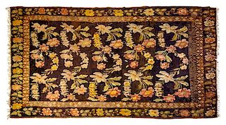 * A Caucasian Rug Approximately 10 feet 6 inches x 6 feet 2 inches.