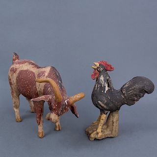 Lote de 2 alcancías. Siglo XX. Elaboradas en barro policromado. Representación de cebú y gallo.