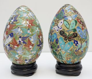 PAIR OF CHAMPLEVE  EGGS ON STANDS