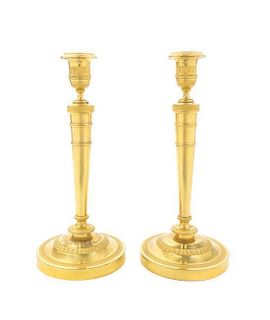 A Pair of Empire Gilt Bronze Candlesticks, Height 11 inches.