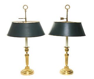 A Pair of Empire Gilt Bronze Candlesticks, Height 26 inches.