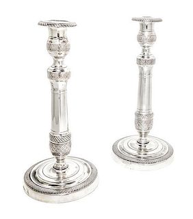 A Pair of Empire Style Silvered Bronze Candlesticks, Height 10 1/2 inches.