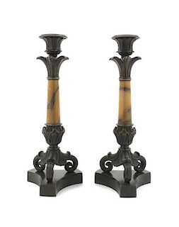 A Pair of Empire Style Patinated Bronze and Sienna Marble Candlesticks, Height 11 inches.