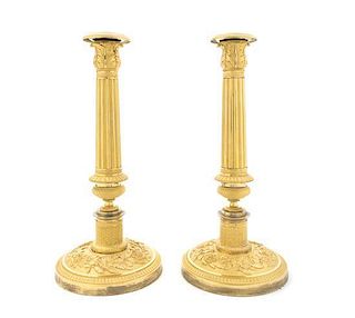 A Pair of Empire Gilt Bronze Candlesticks, Height 10 3/4 inches.