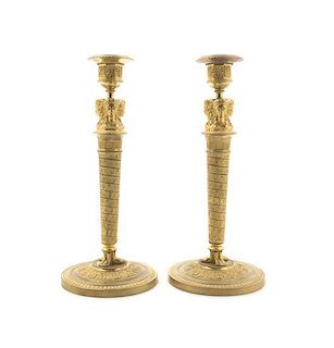A Pair of Empire Gilt Bronze Candlesticks, Height 11 1/4 inches.
