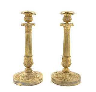 A Pair of Empire Gilt Bronze Candlesticks, Height 10 3/4 inches.